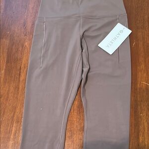Athleta Transcend stash tight legging M/P NWT